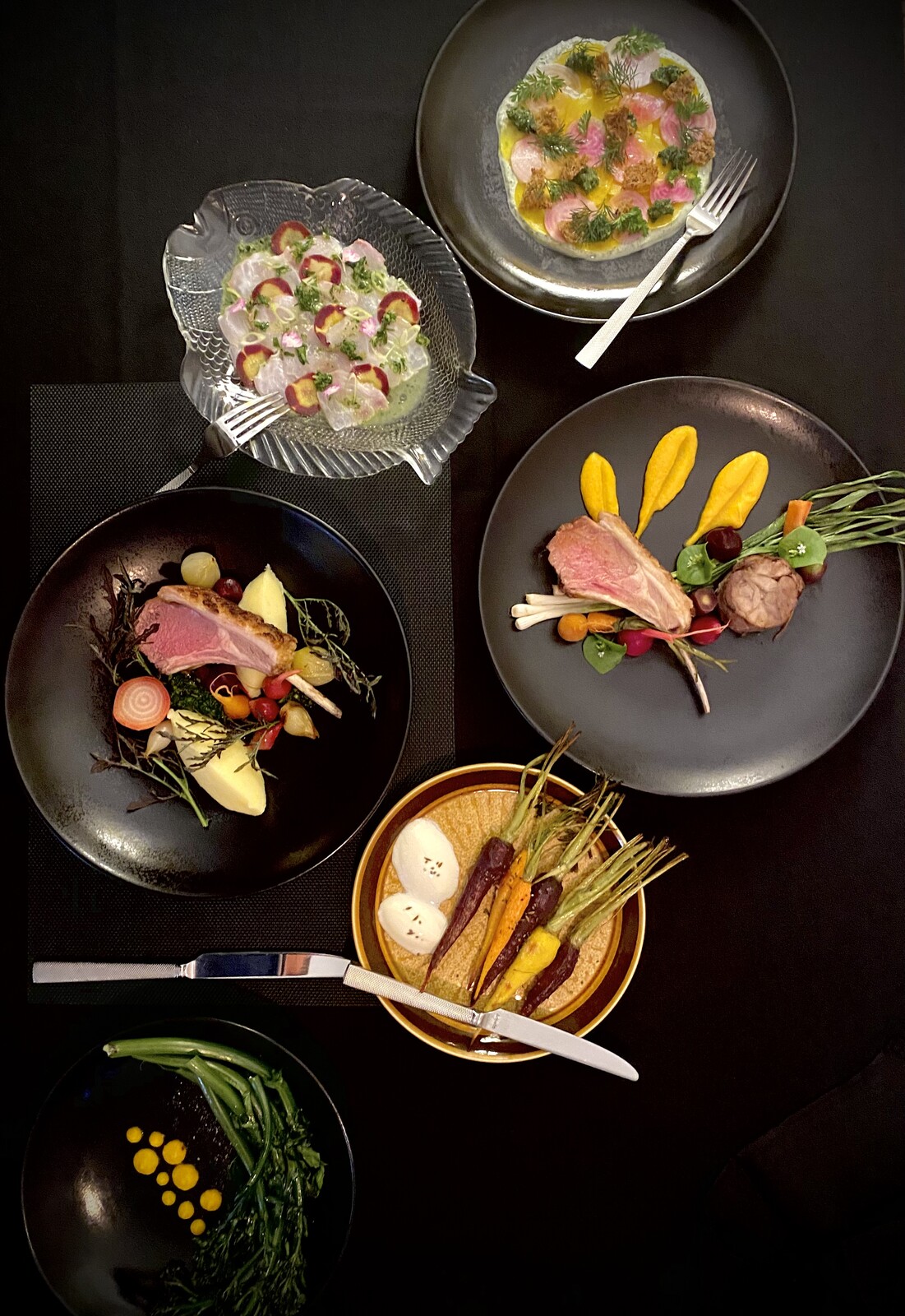 A table of plated Lustre dishes