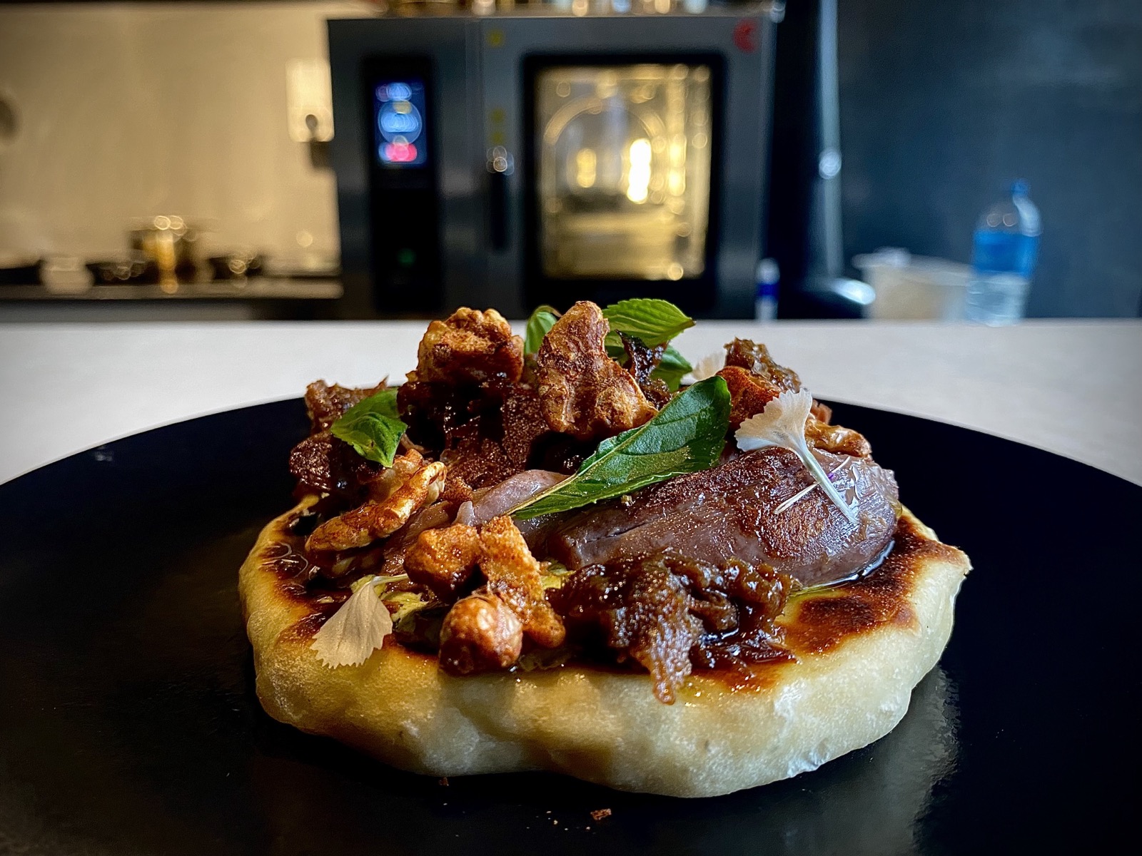 Duck and walnuts on flatbread at the Lustre pass