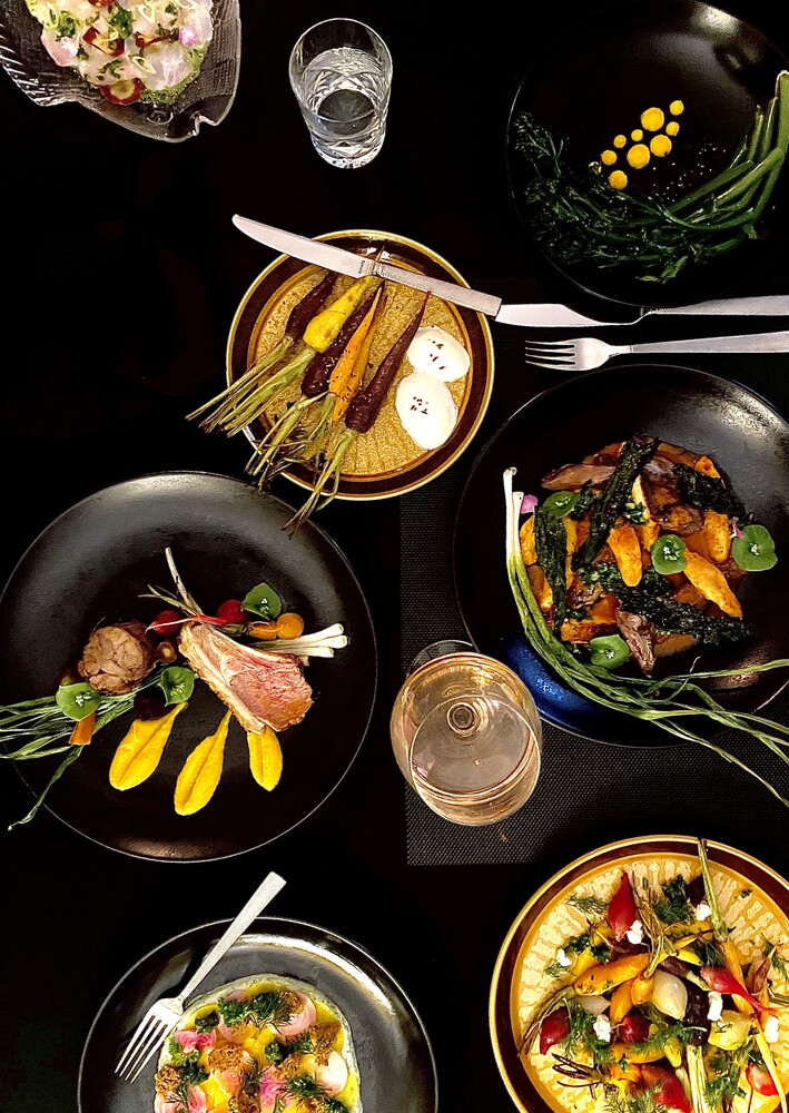 An overhead spread of Lustre tasting dishes